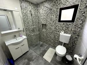 Koupelna v ubytování Guesthouse Apartments