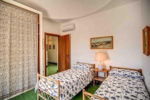 En eller flere senge i et værelse på Villa Circeo, con piscina e scesa al mare + 64 billeder