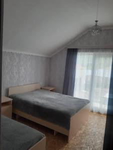 Postel nebo postele na pokoji v ubytování природный апартамент