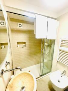 a bathroom with a sink and a toilet and a mirror at B&B Rival room e suite in Andria +6 photos