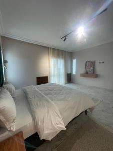 Postel nebo postele na pokoji v ubytování Appart hotel lac 2 Tunis