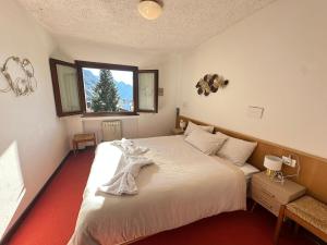 Postel nebo postele na pokoji v ubytování Comfort in the heart of Campligio