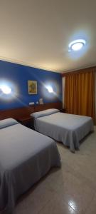 Postel nebo postele na pokoji v ubytování El Faisan C&R Hotel