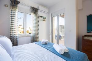 Postel nebo postele na pokoji v ubytování Pigi Paradise Residence