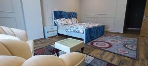 En eller flere senge i et værelse på Serene Oasis