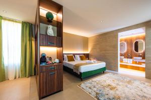 Postel nebo postele na pokoji v ubytování Delle Vittorie Luxury Rooms&Suites