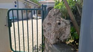 a rock in front of a gate with the word spa written on it at Barbat 249 in Barbat na Rabu +22 photos