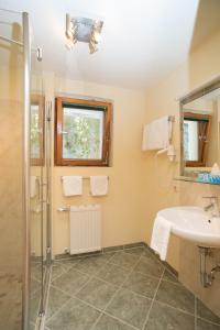 a bathroom with a sink and a shower at Fürbaß Haus in St. Wolfgang