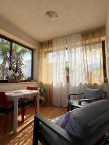 a living room with a couch and a table at Il Giardino del Sole in Villagrazia