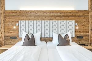 Ένα ή περισσότερα κρεβάτια σε δωμάτιο στο Hotel Garni Schellenberg