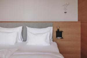 Postel nebo postele na pokoji v ubytování Hotel Schwarzschmied