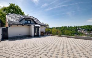 a house with a tile roof and a patio at Awesome Home In Zagreb With Sauna in Zagreb
