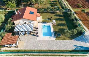 an aerial view of a house with a swimming pool at Stunning Home In Rovinj in Rovinj