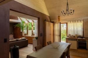 a kitchen and living room with a table and a couch at Private Loft with Hammam & Terrace near Ghent in Sint-Martens-Latem