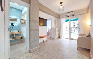a living room with a couch and a table at 2 Bedroom Amazing Apartment In Cullera in Cullera