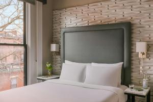a bedroom with a large white bed and a window at No. 284 Back Bay Hotel, Sonder by Marriott Bonvoy in Boston