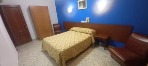 Postel nebo postele na pokoji v ubytování El Faisan C&R Hotel