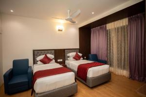 Postel nebo postele na pokoji v ubytování Hotel Grand Tark A Family Hotel Near IGI Airport Delhi