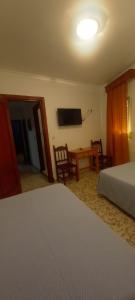 Postel nebo postele na pokoji v ubytování El Faisan C&R Hotel