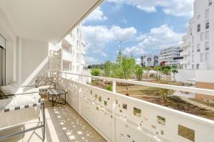 a balcony with a view of a city at Home Sweet Home in Bezons