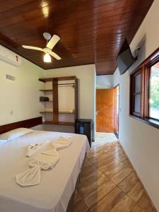 Postel nebo postele na pokoji v ubytování Pousada Recanto Itaguá