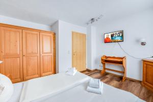 Postel nebo postele na pokoji v ubytování Hotel Garni Nuss