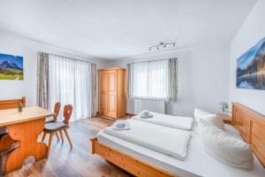 Postel nebo postele na pokoji v ubytování Hotel Garni Nuss + 16 fotografií