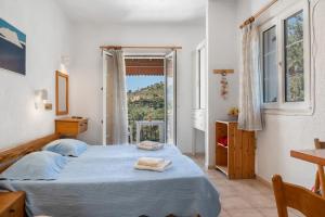 Ένα ή περισσότερα κρεβάτια σε δωμάτιο στο Elite Apartments Kalymnos