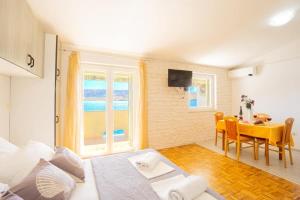 Postel nebo postele na pokoji v ubytování Apartments Galinec