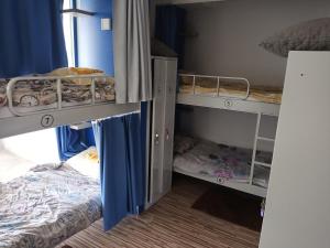 Postel nebo postele na pokoji v ubytování Hostel Renato
