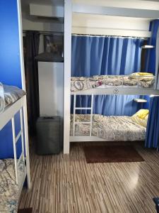 Postel nebo postele na pokoji v ubytování Hostel Renato