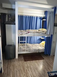 Postel nebo postele na pokoji v ubytování Hostel Renato
