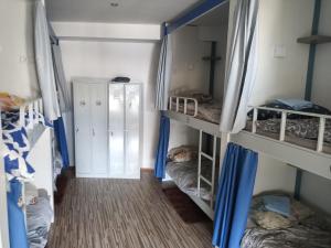 Postel nebo postele na pokoji v ubytování Hostel Renato
