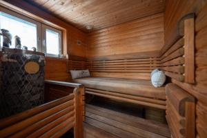 a sauna with a bench in a wooden cabin at Holiday Villa Kallan Pore in Kalajoki