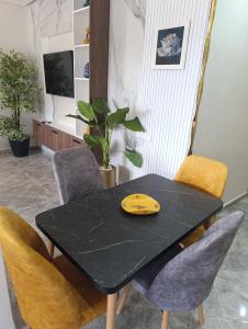 Appartement Golden Beach-Dahomey的电视和/或娱乐中心