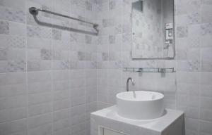 a white bathroom with a sink and a mirror at Ralf House in Hua Hin +34 photos
