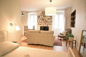a living room with a couch and a fireplace at La Brocante - Meilleurhote-Brioude in Brioude