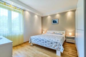 Posteľ alebo postele v izbe v ubytovaní Apartments Ady