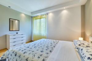 Posteľ alebo postele v izbe v ubytovaní Apartments Ady