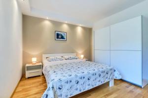 Posteľ alebo postele v izbe v ubytovaní Apartments Ady