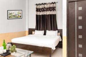 Postel nebo postele na pokoji v ubytování Hotel Sunrise Inn + 21 fotografií