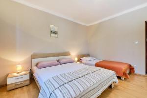 Posteľ alebo postele v izbe v ubytovaní Apartments Ady