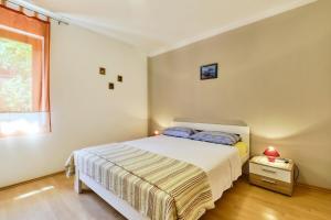 Posteľ alebo postele v izbe v ubytovaní Apartments Ady