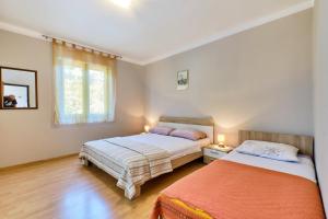 Posteľ alebo postele v izbe v ubytovaní Apartments Ady