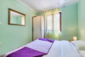 Posteľ alebo postele v izbe v ubytovaní Apartments Ady
