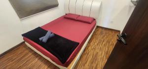 a small bed in a room with a door at K avenue family room by TZ homestay in Donggongon +11 photos
