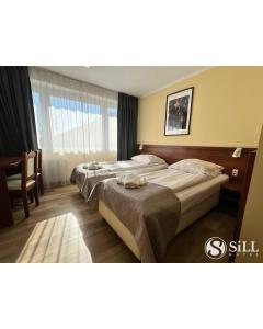 Postel nebo postele na pokoji v ubytování Hotel SiLL