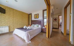 En eller flere senge i et værelse på Club Villamar - Vuitton