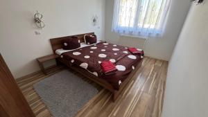Posteľ alebo postele v izbe v ubytovaní Timi wellness Apartman Siófok