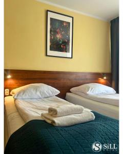 Postel nebo postele na pokoji v ubytování Hotel SiLL